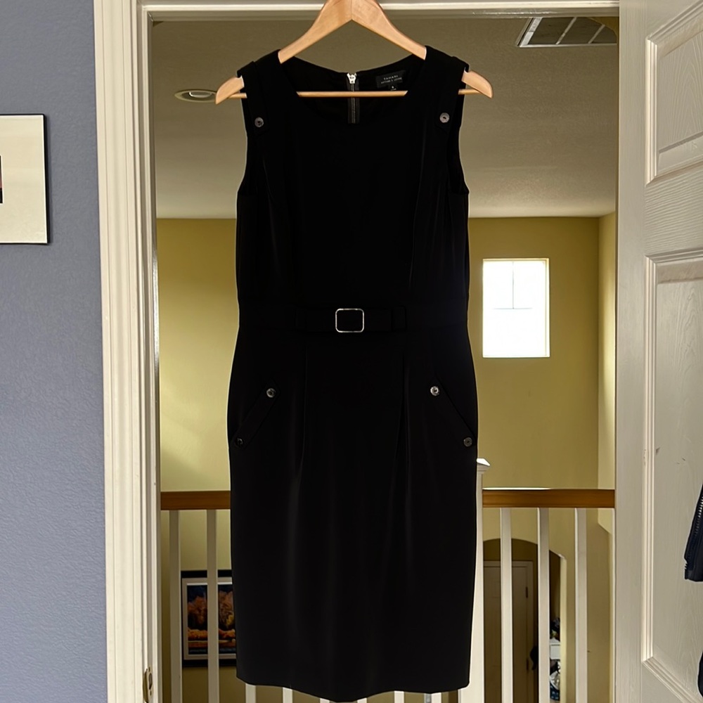 Black lined cocktail dress. Wore once in Paris.